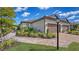 Charming exterior with a brick driveway, manicured landscaping, and a welcoming entrance at 6070 Mesa Gln, Bradenton, FL 34203