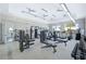 A well-equipped gym features various machines, treadmills, free weights, and plenty of open space with natural light and ceiling fans at 6070 Mesa Gln, Bradenton, FL 34203