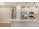 Bright kitchen featuring stainless appliances, quartz countertops, and pendant lighting at 6070 Mesa Gln, Bradenton, FL 34203
