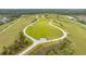 Aerial shot of the recreation area, with winding paths and natural landscaping in a residential community at 6070 Mesa Gln, Bradenton, FL 34203