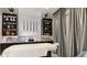 Relaxing spa area with sleek design, elegant shelving, massage table, and stylish decor at 6070 Mesa Gln, Bradenton, FL 34203