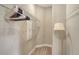 Walk-in closet with wire shelving and neutral walls, lit by a floor lamp at 6070 Mesa Gln, Bradenton, FL 34203