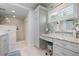 Bathroom vanity boasts granite countertop, vanity, and view to a glass shower at 612 Foxworth Ln, Holmes Beach, FL 34217