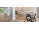 Open dining space with stylish floors, and access to outdoor living at 6433 Blue Grosbeak Cir, Lakewood Ranch, FL 34202