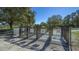 Entrance to the fenced dog park with separate entrance and exit gates at 6433 Blue Grosbeak Cir, Lakewood Ranch, FL 34202