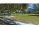 Shaded benches and lush green space at the community dog park at 6433 Blue Grosbeak Cir, Lakewood Ranch, FL 34202