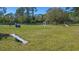 Well-maintained dog park featuring various agility equipment and lush green grass at 6433 Blue Grosbeak Cir, Lakewood Ranch, FL 34202