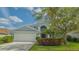 Charming two-story home with a well-manicured lawn and a two-car garage at 6433 Blue Grosbeak Cir, Lakewood Ranch, FL 34202