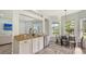 Bright kitchen featuring granite counters and breakfast nook with views of the backyard at 6433 Blue Grosbeak Cir, Lakewood Ranch, FL 34202