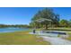 Lakeside picnic area with a covered table and scenic water views at 6433 Blue Grosbeak Cir, Lakewood Ranch, FL 34202