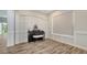Well-lit living space showing a built-in feature and a large window at 6433 Blue Grosbeak Cir, Lakewood Ranch, FL 34202