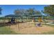 Colorful playground featuring swings and slides at 6433 Blue Grosbeak Cir, Lakewood Ranch, FL 34202