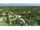 A high-angle view of the home surrounded by verdant trees and other homes at 6510 24Th E Ave, Bradenton, FL 34208