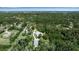 An aerial view presents this home's serene setting among lush greenery and other homes at 6510 24Th E Ave, Bradenton, FL 34208