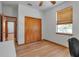 Bedroom with wood floors and closet and a window providing natural light at 6510 24Th E Ave, Bradenton, FL 34208