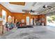 Garage with wooden walls, storage, and concrete floor at 6510 24Th E Ave, Bradenton, FL 34208