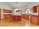 Bright kitchen with ample storage, tile floors, a kitchen island with seating and natural light from the window at 6510 24Th E Ave, Bradenton, FL 34208