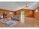 Spacious living room featuring light colored couch, neutral decor, and bright light from a large window at 6510 24Th E Ave, Bradenton, FL 34208