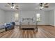 Spacious main bedroom with wood flooring, multiple ceiling fans, and ample natural light for a serene retreat at 6510 24Th E Ave, Bradenton, FL 34208