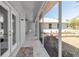 Covered patio features tile flooring and is enclosed with screened windows at 6510 24Th E Ave, Bradenton, FL 34208