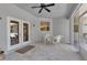 Covered patio featuring white wicker furniture and light tile flooring at 6510 24Th E Ave, Bradenton, FL 34208