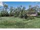 The on-site pond surrounded by mature foliage adds to the serenity of this property at 6510 24Th E Ave, Bradenton, FL 34208