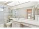 The light bathroom features a large mirror, vanity, and shower with tub at 6812 19Th W Ave, Bradenton, FL 34209