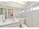 The updated bathroom features a vanity, toilet, and tiled walk-in shower at 6812 19Th W Ave, Bradenton, FL 34209