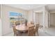 Cozy dining area with a wooden table, woven chairs, and natural light, perfect for enjoying Gathering meals and entertaining guests at 6812 19Th W Ave, Bradenton, FL 34209