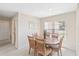 Inviting dining area with neutral walls, a wooden table, woven chairs, creating a comfortable and welcoming dining space at 6812 19Th W Ave, Bradenton, FL 34209