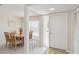 Bright dining area with a wooden table, woven chairs, and natural light, perfect for enjoying Gathering meals and entertaining guests at 6812 19Th W Ave, Bradenton, FL 34209