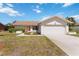 Inviting home with a tidy front lawn, a well-kept driveway, and a two-car garage, presenting a welcoming exterior at 6812 19Th W Ave, Bradenton, FL 34209
