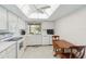 Bright kitchen with white cabinets, a ceiling fan and skylight, and plenty of counter space, making meal preparation a breeze at 6812 19Th W Ave, Bradenton, FL 34209