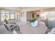 Inviting sunroom with dining set and lounge chairs, seamlessly connected to the home's interior at 6812 19Th W Ave, Bradenton, FL 34209