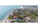 Coastal community with a modern home featuring beach access and stunning ocean views at 7324 Point Of Rocks Rd, Sarasota, FL 34242