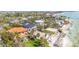 Desirable beachfront property with palm trees and convenient ocean access for coastal enjoyment at 7324 Point Of Rocks Rd, Sarasota, FL 34242