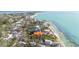 Beautiful aerial view featuring waterfront properties on the coast, nestled among mature trees and overlooking serene waterways at 7324 Point Of Rocks Rd, Sarasota, FL 34242