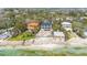 Beachfront living with palm trees, featuring a pool and scenic access to the sandy shore at 7324 Point Of Rocks Rd, Sarasota, FL 34242