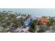 Aerial shot of a modern home close to the beach and with lush greenery at 7324 Point Of Rocks Rd, Sarasota, FL 34242