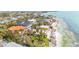 Coastal home with a pool, beach access, and tropical landscaping for relaxed beach living at 7324 Point Of Rocks Rd, Sarasota, FL 34242