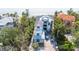 New modern beachfront home features large windows and a multi-level design, offering stunning ocean views at 7324 Point Of Rocks Rd, Sarasota, FL 34242