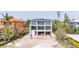 Modern home with large windows and balconies that highlight its design, promising ample natural light at 7324 Point Of Rocks Rd, Sarasota, FL 34242