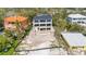 Modern home's balconies offer a view of the property's outdoor potential, set in a desirable location at 7324 Point Of Rocks Rd, Sarasota, FL 34242
