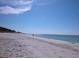 Scenic view of a sandy beach with the calm ocean on a bright sunny day at 105 47Th Avenue W Dr # 377, Bradenton, FL 34207