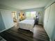 Comfortable bedroom with sliding glass doors to the lanai, plus closet space and nice natural light at 105 47Th Avenue W Dr # 377, Bradenton, FL 34207