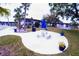 Community space features picnic table, umbrella, seating and grill at 105 47Th Avenue W Dr # 377, Bradenton, FL 34207