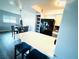 Bright eat-in kitchen with white countertop and black refrigerator, plus a pendant light fixture at 105 47Th Avenue W Dr # 377, Bradenton, FL 34207