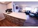 Contemporary kitchen with quartz countertops, stainless steel sink, and an open view to the living room at 105 47Th Avenue W Dr # 377, Bradenton, FL 34207
