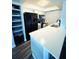 Efficient kitchen layout with white countertops, modern appliances, and ample storage solutions at 105 47Th Avenue W Dr # 377, Bradenton, FL 34207