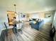 Inviting living room with stylish furnishings, wood-look flooring, and a cozy dining nook at 105 47Th Avenue W Dr # 377, Bradenton, FL 34207